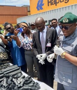 COMPT ANANI WRESTLES SMUGGLERS; AS TIN CAN CUSTOMS COMMAND INTERCEPTS ANOTHER BATCH OF 204 PUMP-ACTION RIFLES